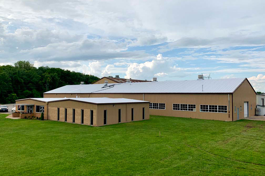 Building with a finished roof coating applied by ArmorGuard.